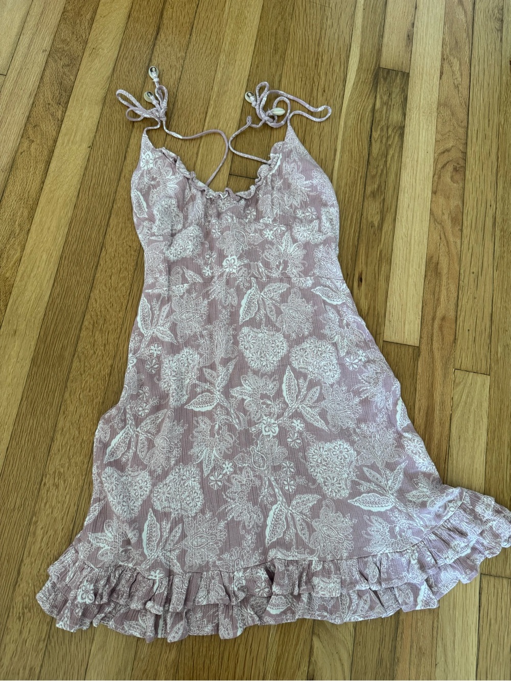 Paradise Pink Floral Mini Dress with adjustable seashell straps and ruffle hem